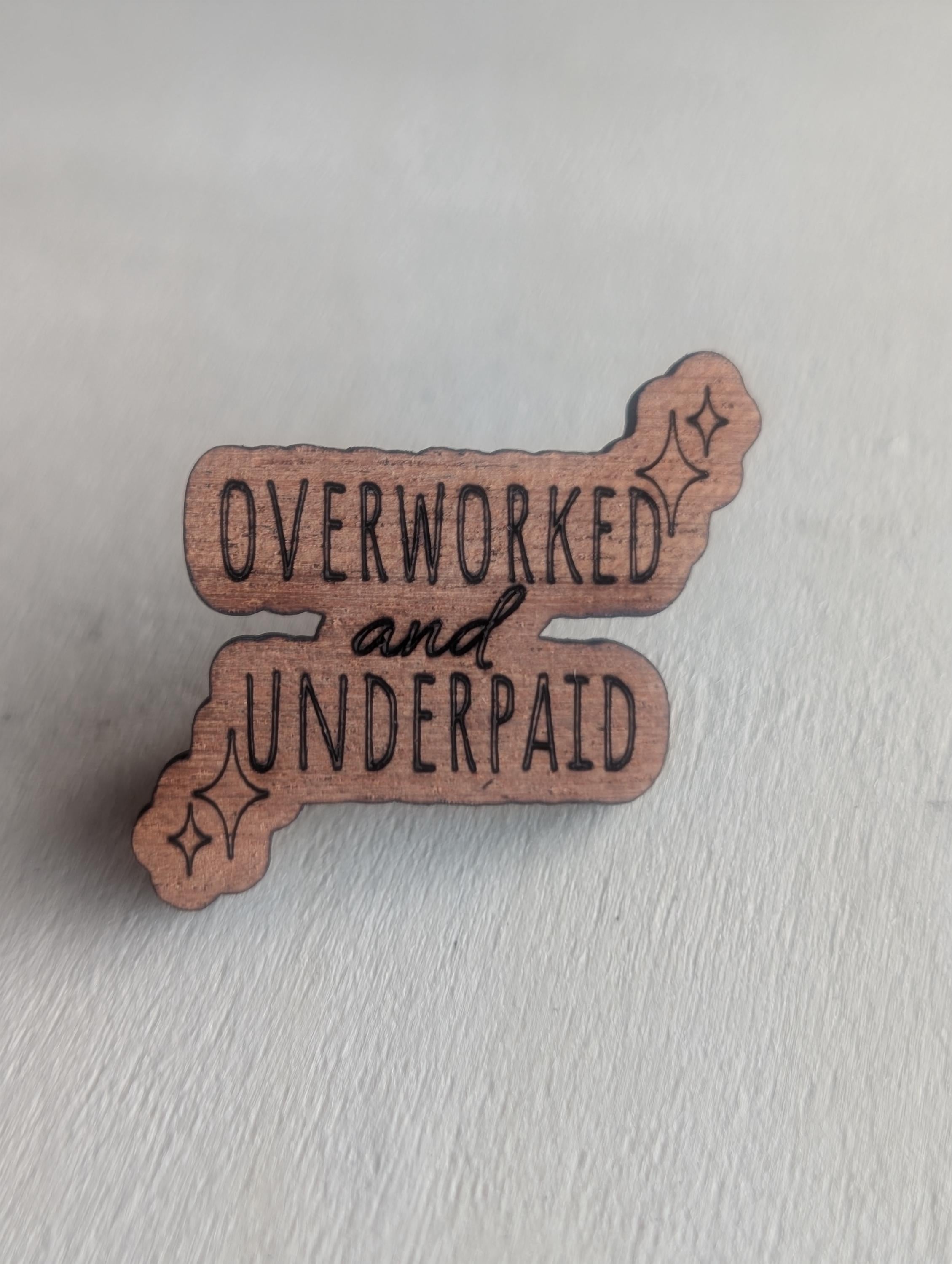 Mahogany overworked and underpaid wooden pin badge, funny badges