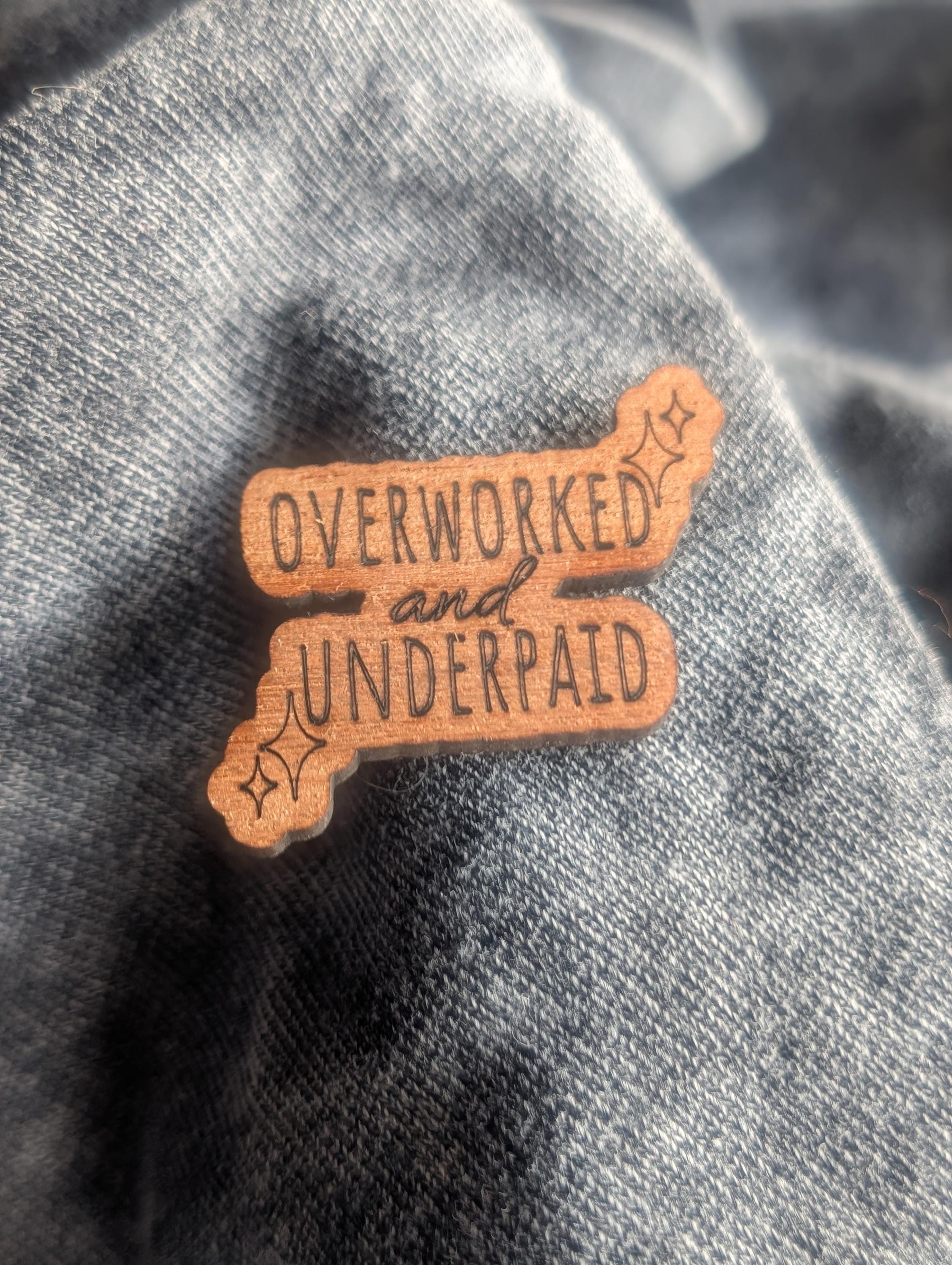 Mahogany overworked and underpaid wooden pin badge, funny badges