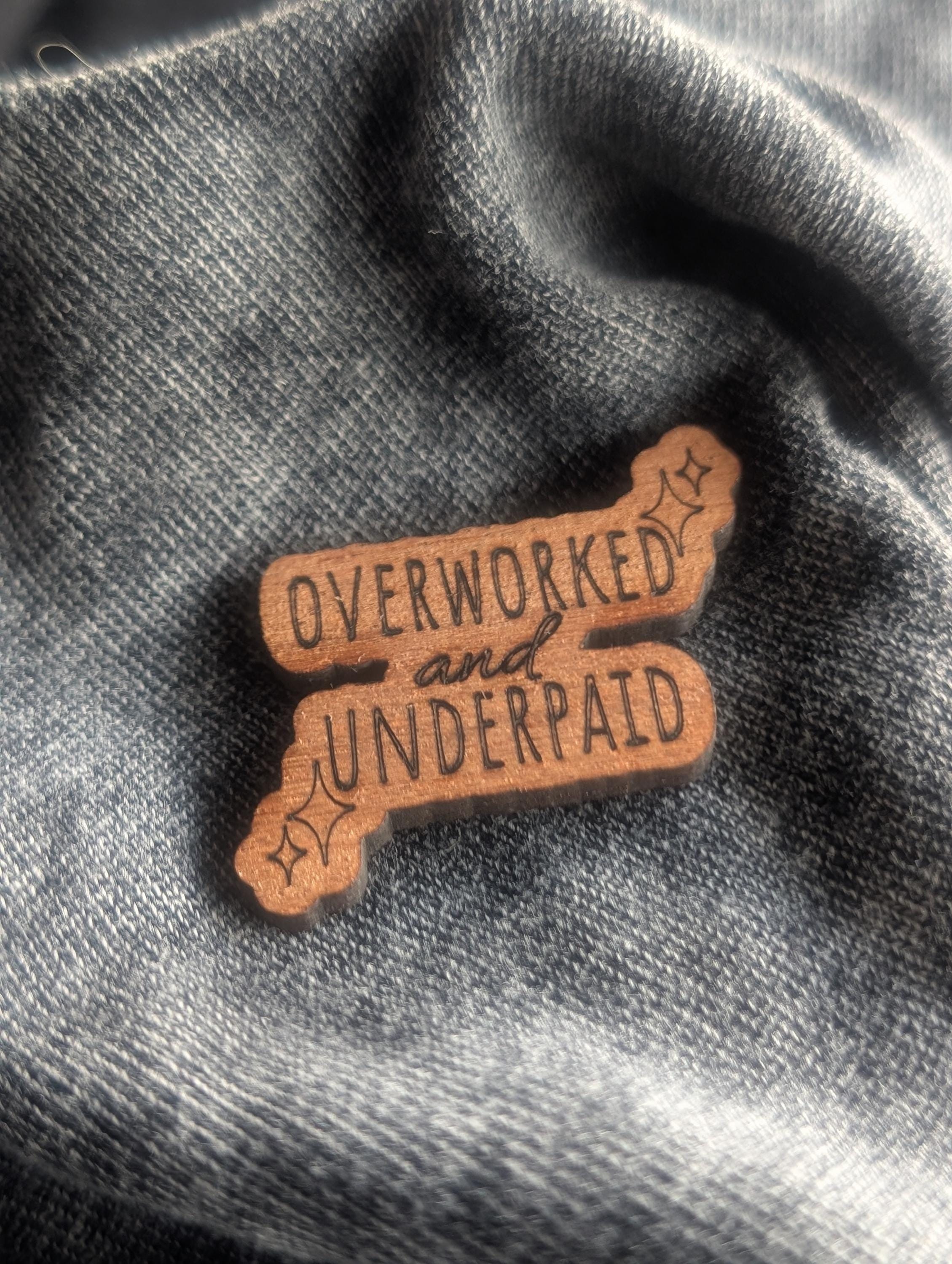 Mahogany overworked and underpaid wooden pin badge, funny badges